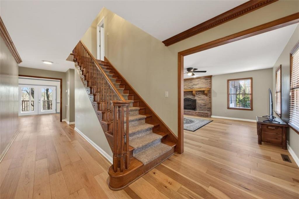 294 Hillcrest Heights Cornelia, GA 30531 - Photo 4 of 66 a view of an entryway with wooden floor and stairs