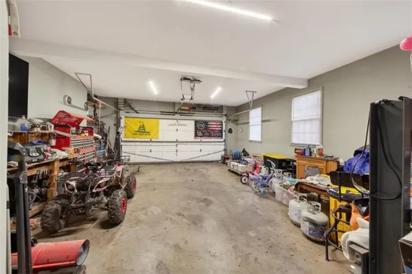 a living room with furniture and a rug