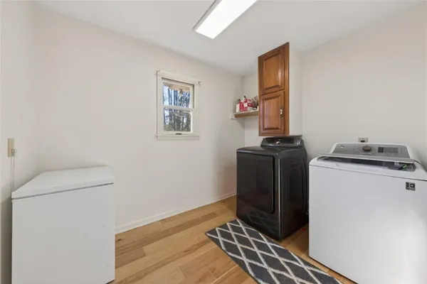 a view of a room with wooden floor and stairs