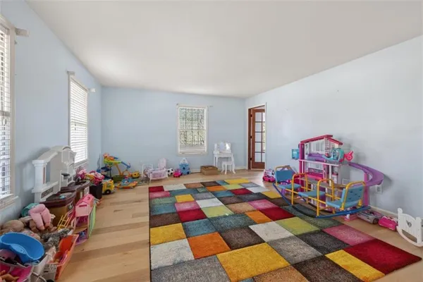 a room with toys and wooden floor