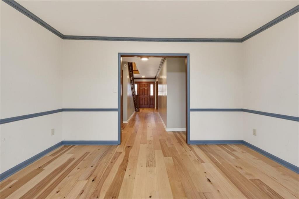 294 Hillcrest Heights Cornelia, GA 30531 - Photo 55 of 66 a view of a room with wooden floor and stairs