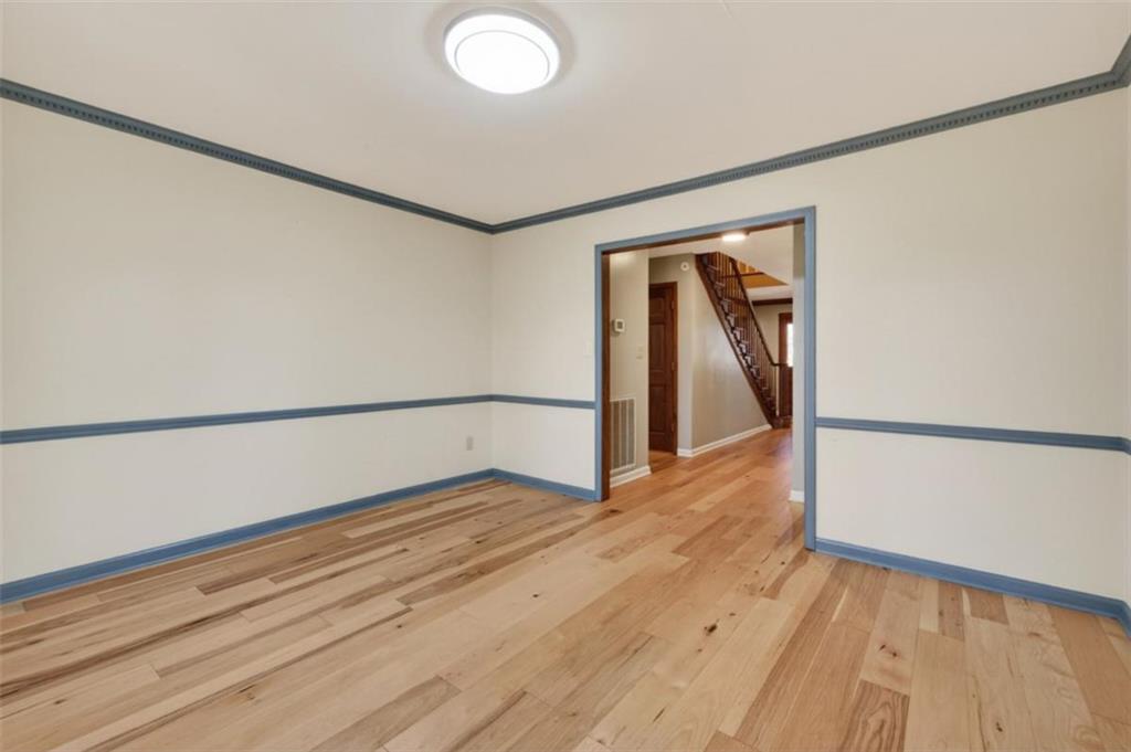 294 Hillcrest Heights Cornelia, GA 30531 - Photo 56 of 66 a view of an empty room with wooden floor and a window