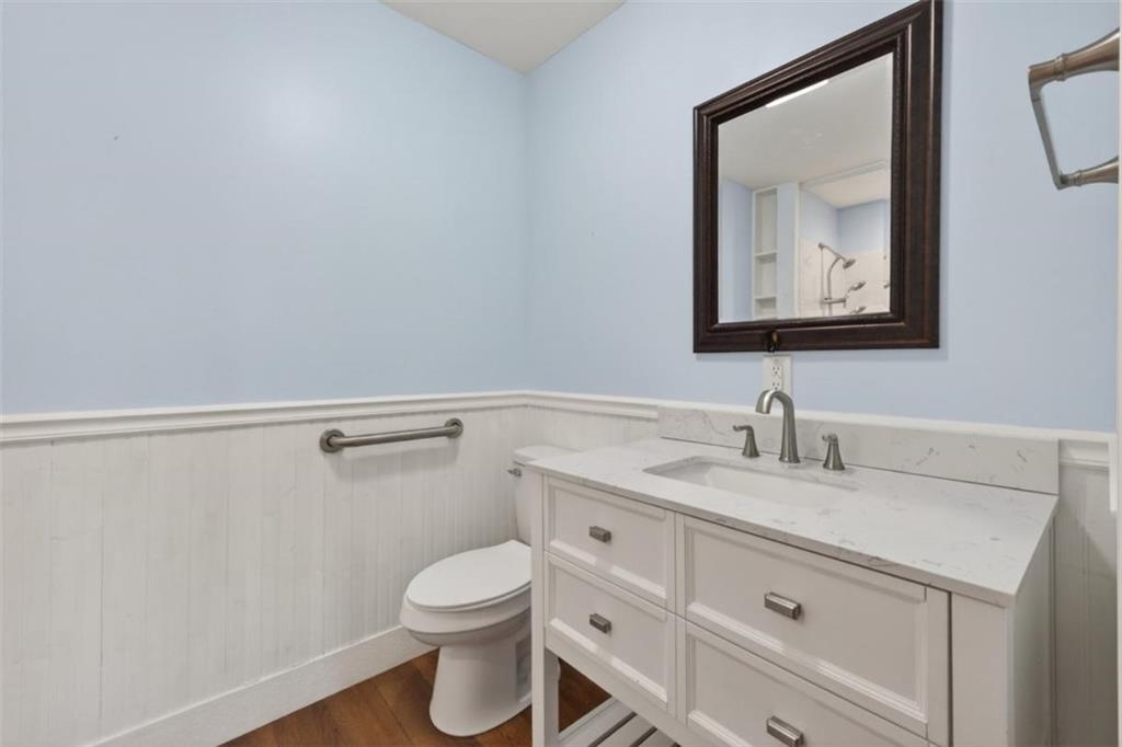 294 Hillcrest Heights Cornelia, GA 30531 - Photo 59 of 66 a bathroom with a granite countertop sink vanity mirror and toilet