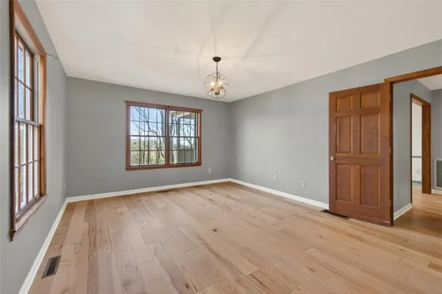 a view of a hallway with washer and dryer