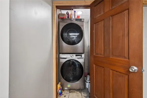a bedroom with a large bed and a dresser