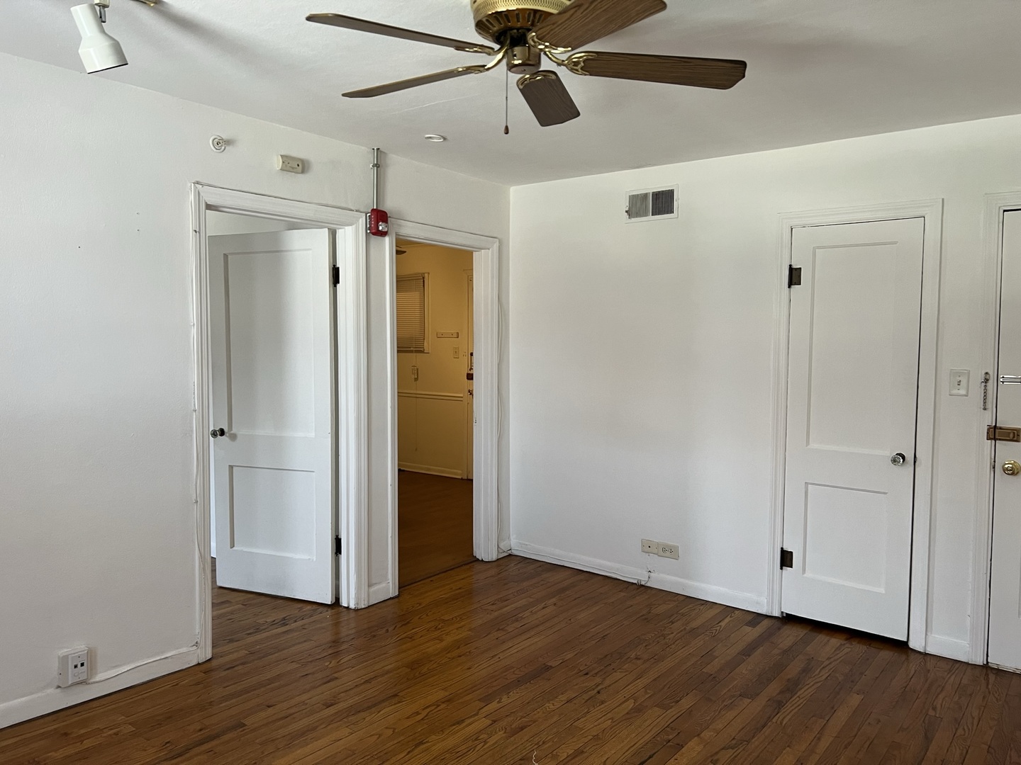 10 East Jefferson Avenue, Unit 2 Naperville, IL 60540 - Photo 4 of 13 a view of an empty room and wooden floor