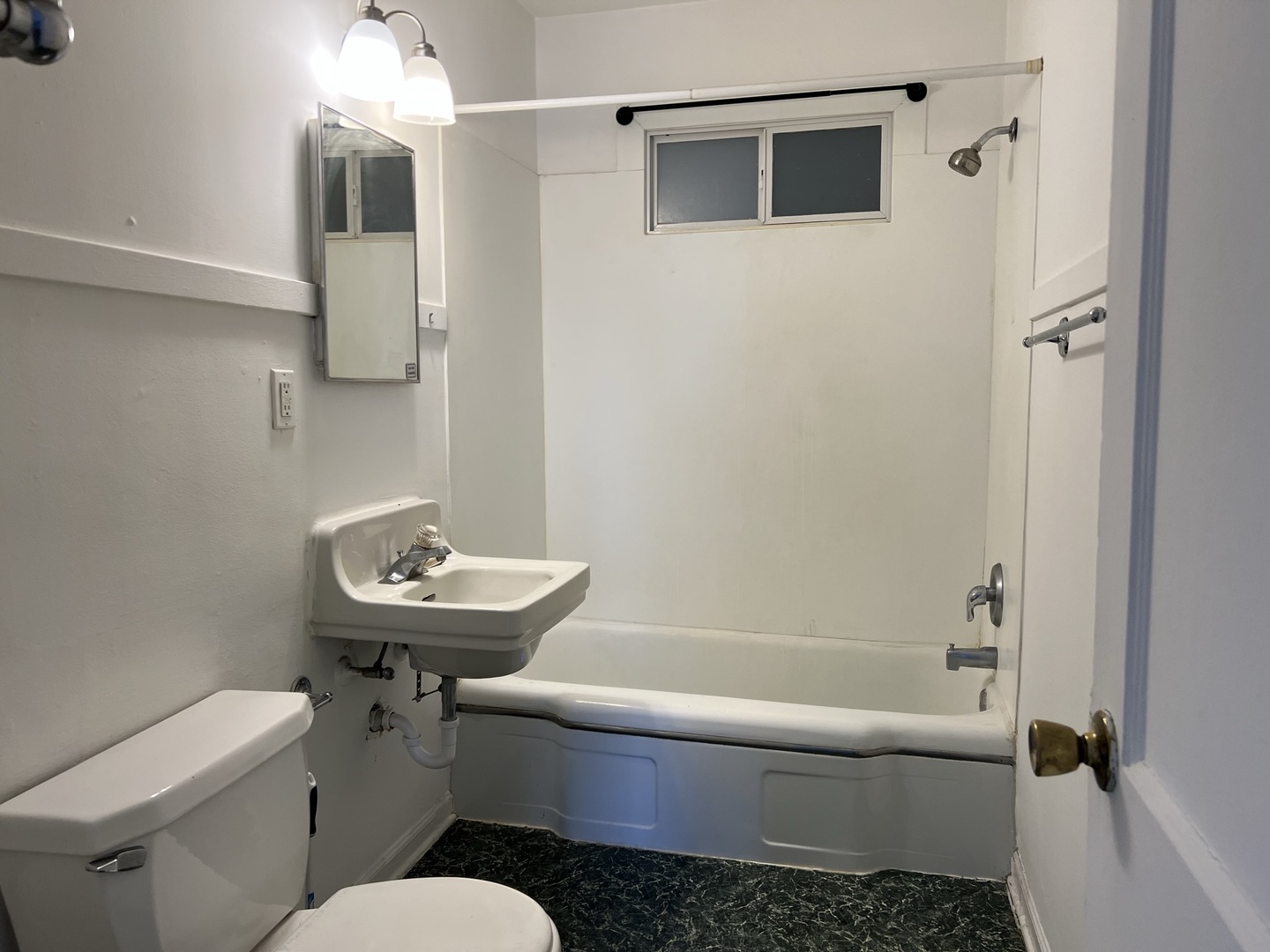 10 East Jefferson Avenue, Unit 2 Naperville, IL 60540 - Photo 7 of 13 a bathroom with a sink a toilet and shower