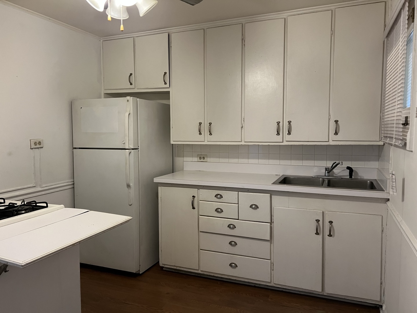10 East Jefferson Avenue, Unit 2 Naperville, IL 60540 - Photo 9 of 13 a kitchen with cabinets appliances and a sink