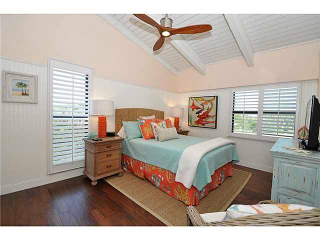 2355 Northeast Ocean Boulevard, Unit 37B Stuart, FL 34996 - Photo 11 of 24 a bedroom with a bed dresser and a window