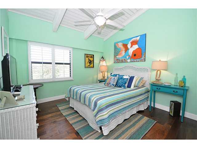 2355 Northeast Ocean Boulevard, Unit 37B Stuart, FL 34996 - Photo 17 of 24 a bedroom with a bed and a window