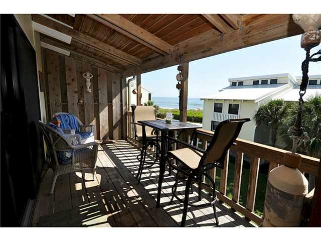2355 Northeast Ocean Boulevard, Unit 37B Stuart, FL 34996 - Photo 20 of 24 a view of a patio with table and chairs