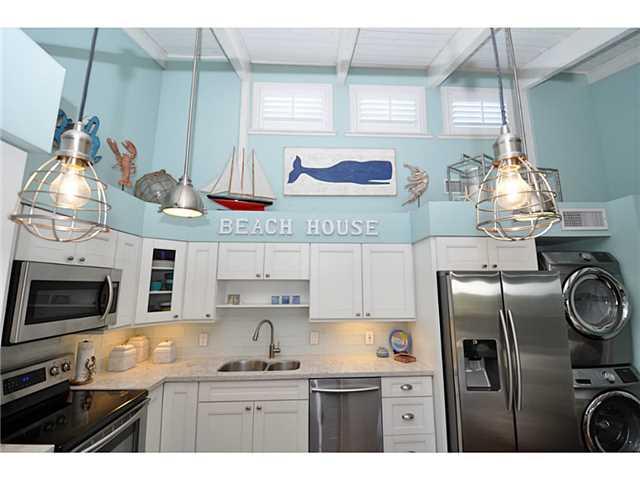 2355 Northeast Ocean Boulevard, Unit 37B Stuart, FL 34996 - Photo 6 of 24 a kitchen with stainless steel appliances granite countertop a stove and a sink