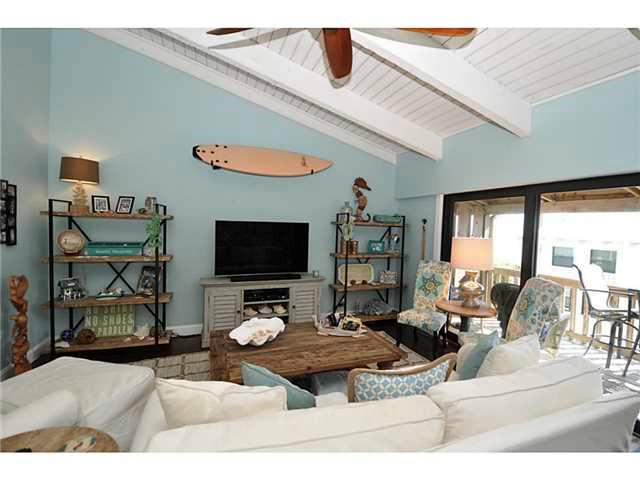 2355 Northeast Ocean Boulevard, Unit 37B Stuart, FL 34996 - Photo 7 of 24 a living room with furniture and a flat screen tv