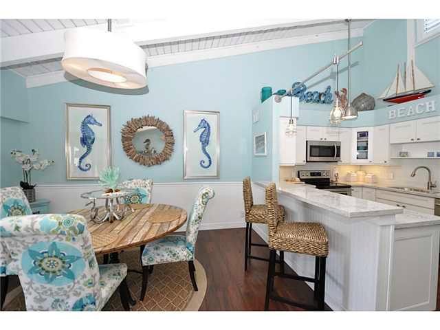 2355 Northeast Ocean Boulevard, Unit 37B Stuart, FL 34996 - Photo 8 of 24 a view of a dining room with furniture and wooden floor
