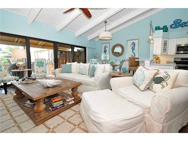 2355 Northeast Ocean Boulevard, Unit 37B Stuart, FL 34996 - Photo 9 of 24 a living room with furniture a table and a large window
