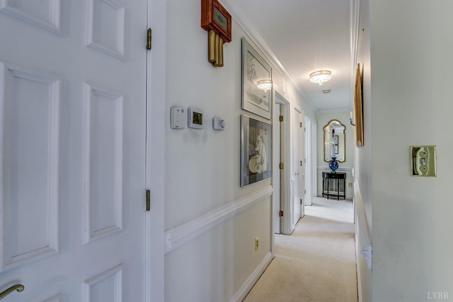 117 Sailview Drive Forest, VA 24551 - Photo 13 of 55 a view of a hallway with wooden shelves