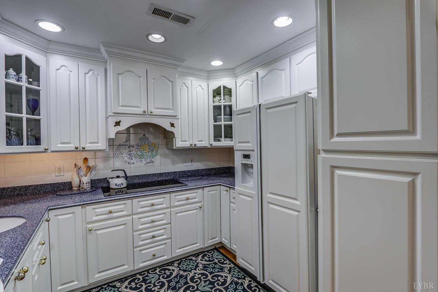 117 Sailview Drive Forest, VA 24551 - Photo 19 of 55 a kitchen with kitchen island granite countertop appliances cabinets and a sink