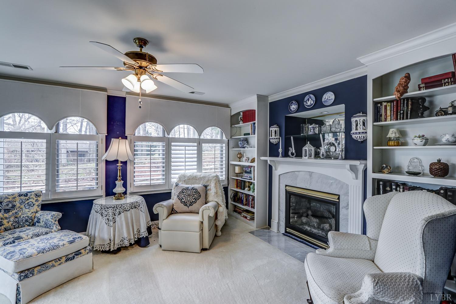 117 Sailview Drive Forest, VA 24551 - Photo 29 of 55 a living room with furniture fireplace and flat screen tv