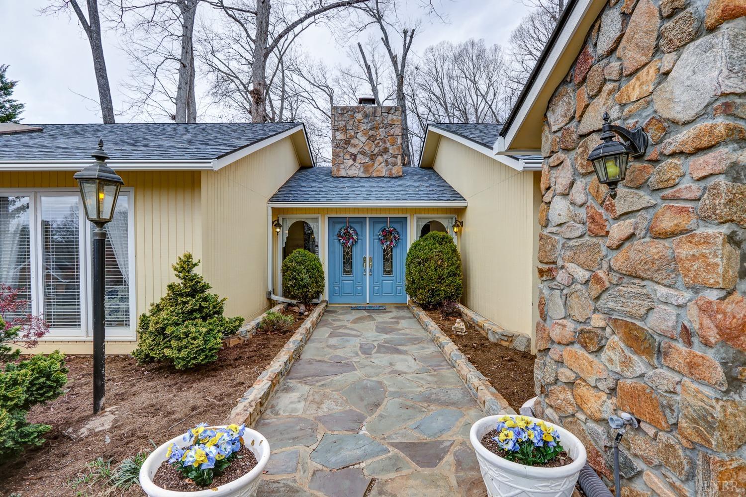 117 Sailview Drive Forest, VA 24551 - Photo 5 of 55 a front view of a house with garden
