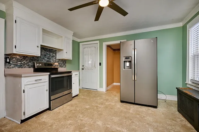 a kitchen with stainless steel appliances a refrigerator a stove a sink a washer and dishwasher