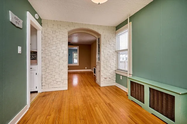 a view of hallway with wooden floor