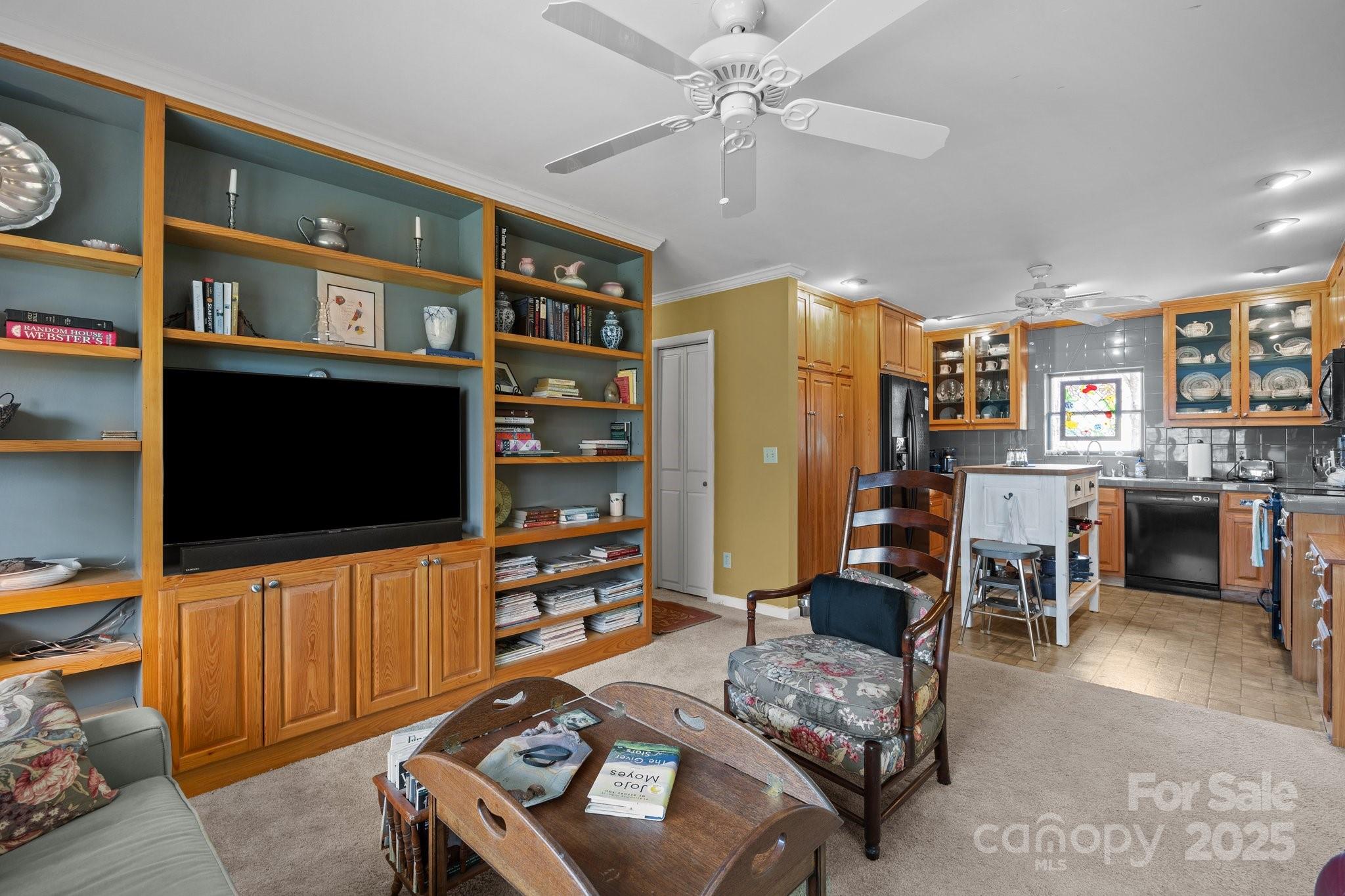 457 Overlook Drive Spruce Pine, NC 28777 - Photo 11 of 33 a living room with furniture and a flat screen tv