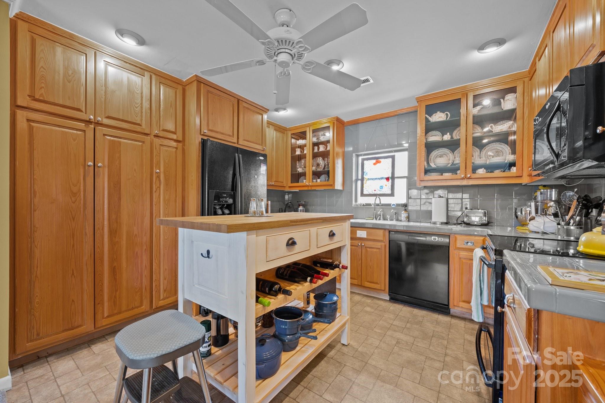 457 Overlook Drive Spruce Pine, NC 28777 - Photo 13 of 33 a kitchen with stainless steel appliances granite countertop a sink stove and refrigerator