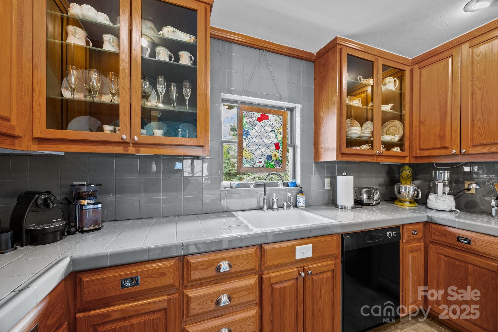 457 Overlook Drive Spruce Pine, NC 28777 - Photo 14 of 33 a kitchen with stainless steel appliances granite countertop a sink a stove and cabinets