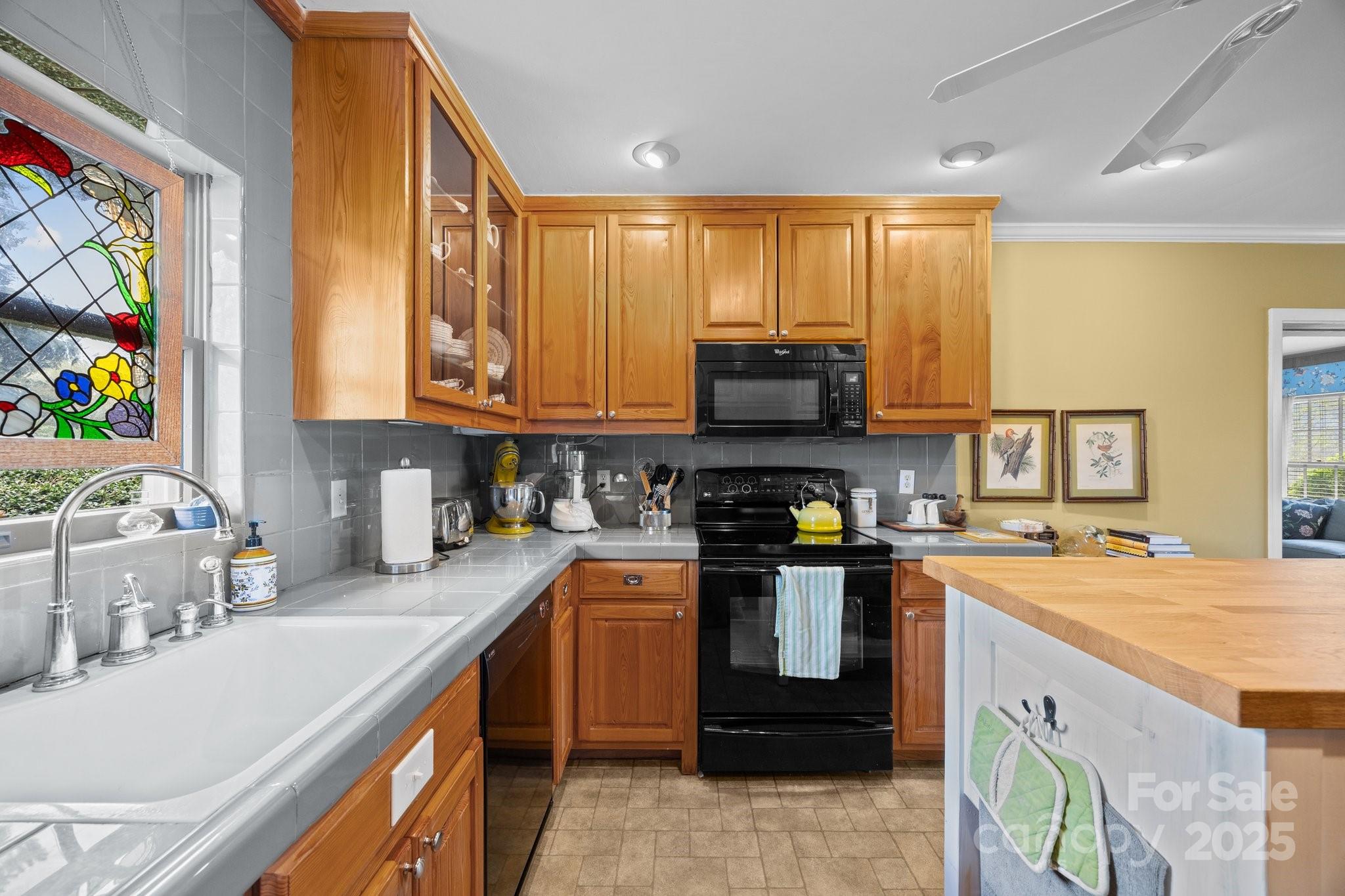 457 Overlook Drive Spruce Pine, NC 28777 - Photo 15 of 33 a kitchen with stainless steel appliances granite countertop a sink stove and refrigerator
