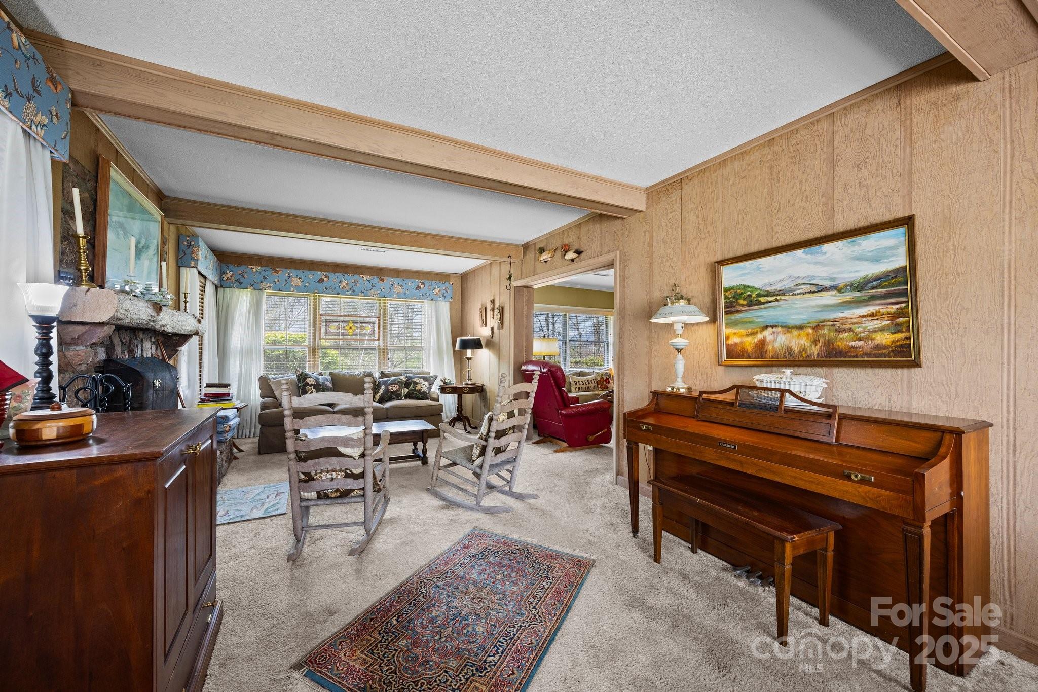 457 Overlook Drive Spruce Pine, NC 28777 - Photo 2 of 33 a living room with furniture and a flat screen tv