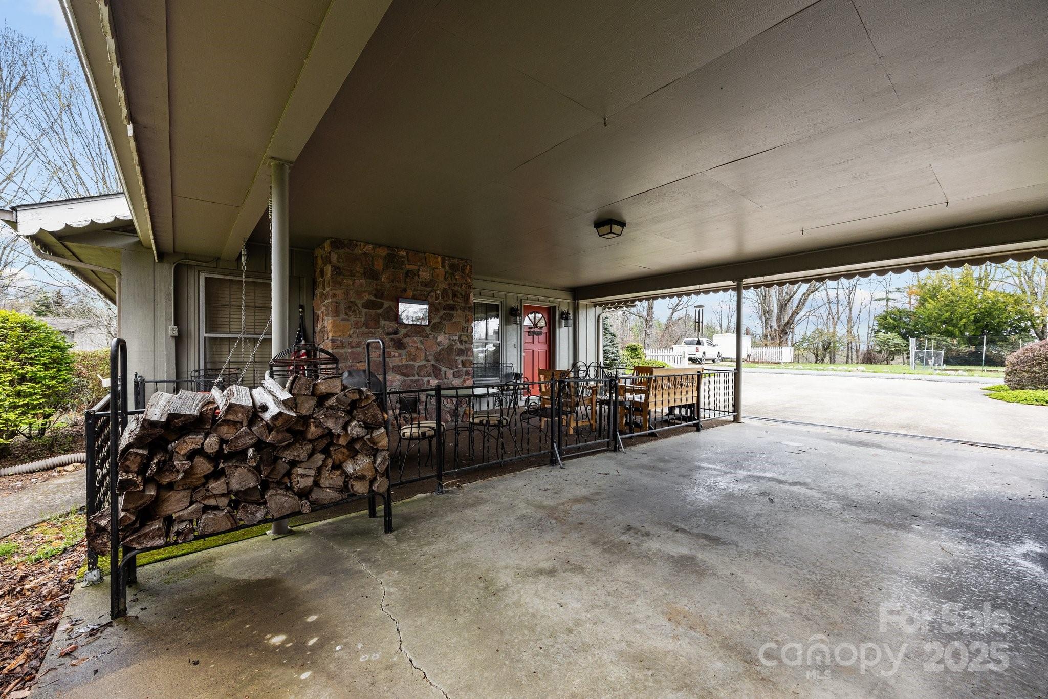 457 Overlook Drive Spruce Pine, NC 28777 - Photo 25 of 33 a view of a chairs and tables in patio