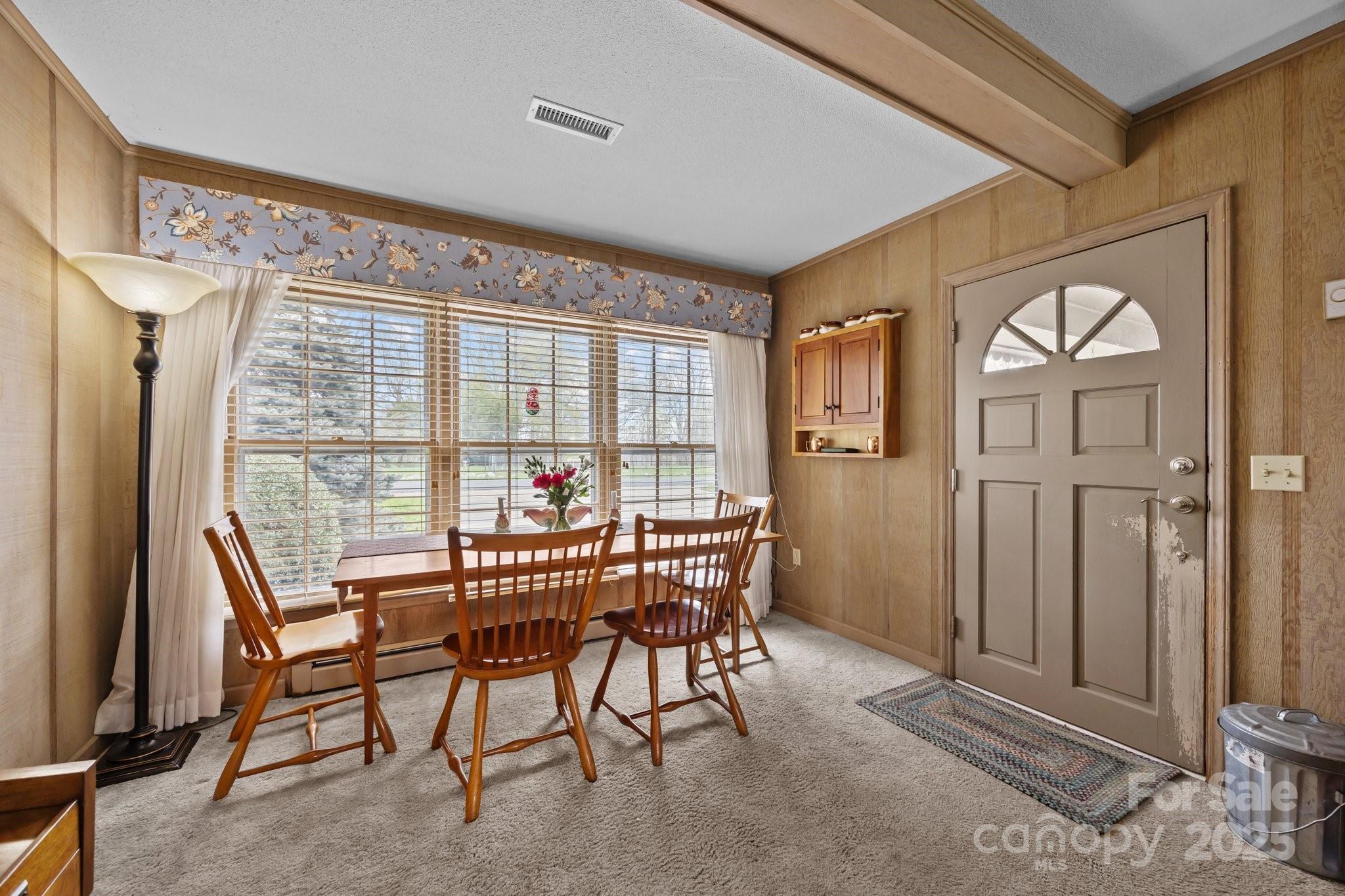 457 Overlook Drive Spruce Pine, NC 28777 - Photo 3 of 33 a view of a dining room with furniture and a window