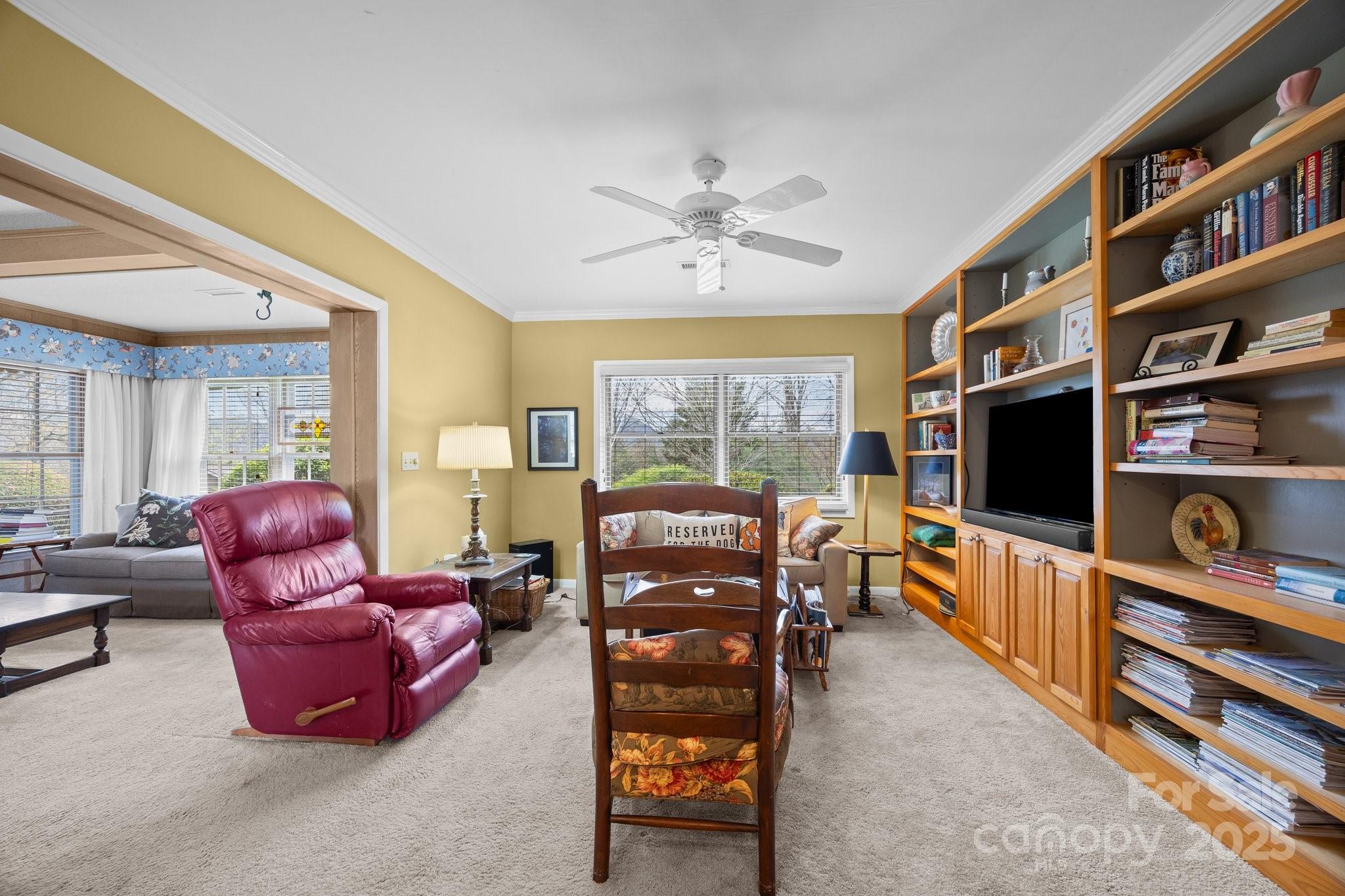 457 Overlook Drive Spruce Pine, NC 28777 - Photo 7 of 33 a living room with furniture and a flat screen tv