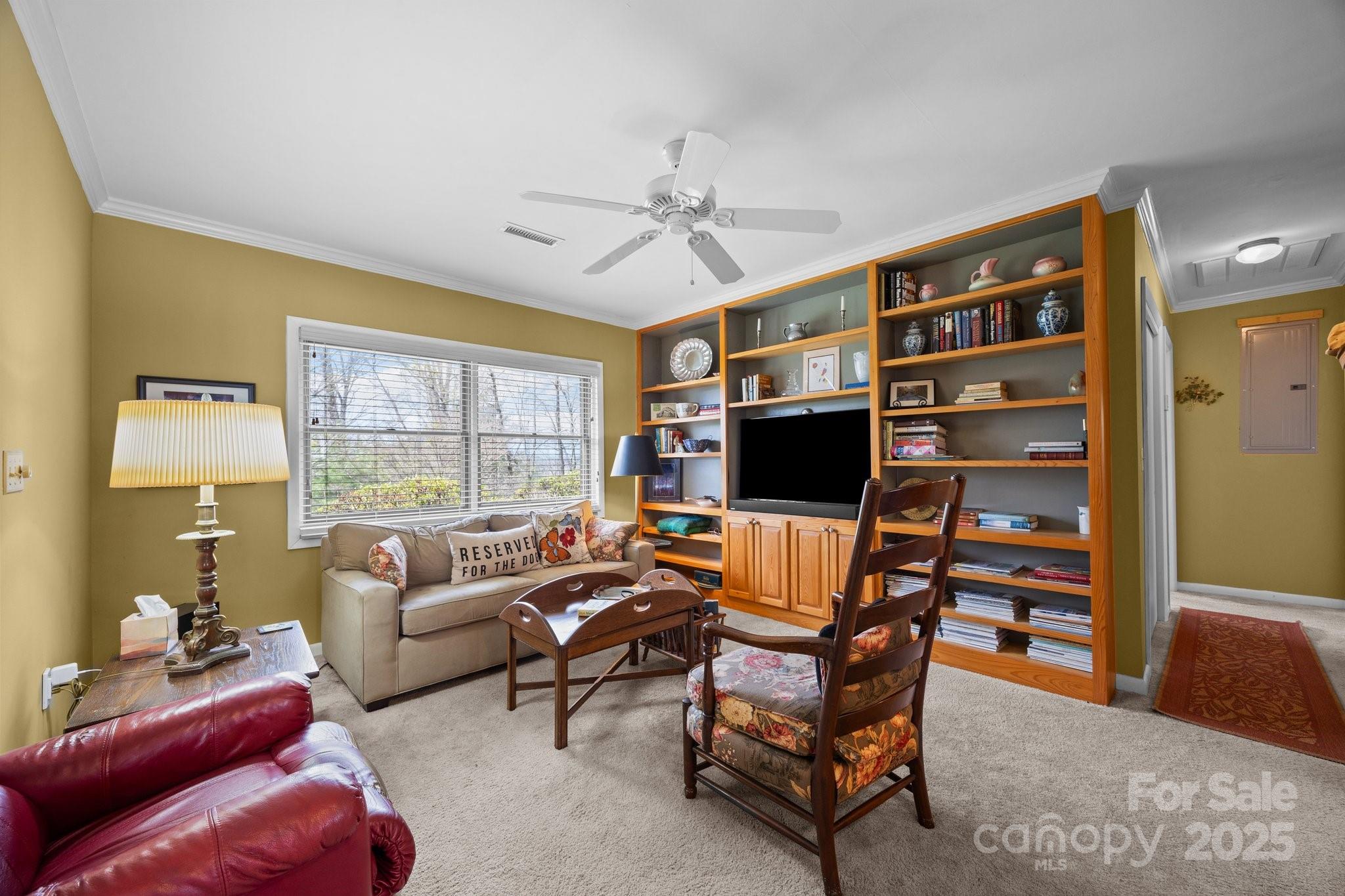 457 Overlook Drive Spruce Pine, NC 28777 - Photo 8 of 33 a living room with furniture a flat screen tv and a window