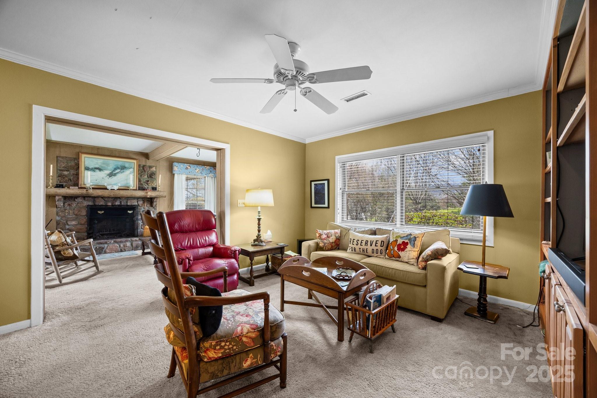 457 Overlook Drive Spruce Pine, NC 28777 - Photo 9 of 33 a living room with furniture a flat screen tv and a large window
