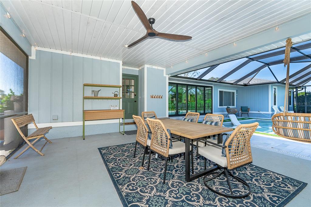 320 Anchor Row Placida, FL 33946 - Photo 16 of 41 a dining room with furniture a rug and a large window