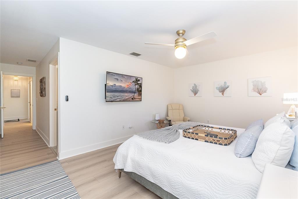 320 Anchor Row Placida, FL 33946 - Photo 23 of 41 a bedroom with a bed and a chandelier