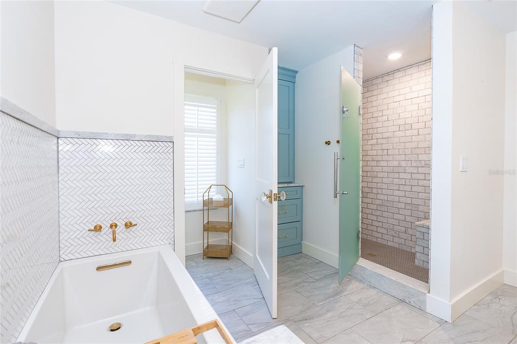 320 Anchor Row Placida, FL 33946 - Photo 26 of 41 a bathroom with a tub shower and sink