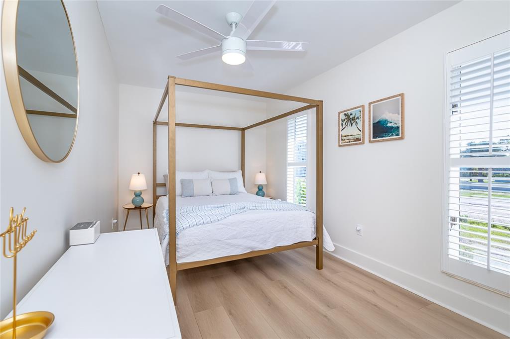 320 Anchor Row Placida, FL 33946 - Photo 32 of 41 a bedroom with a large bed and a chandelier