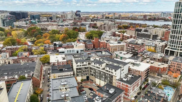 an aerial view of residential building and parking space
