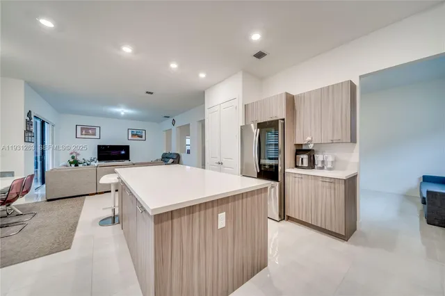 a view of an empty room and a window
