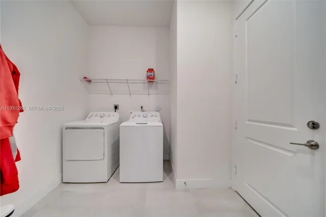 a bathroom with a tub sink mirror and shower