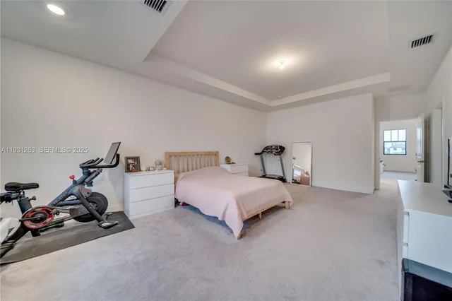 a bedroom with furniture and wooden floor