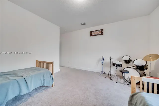 an aerial view of multiple houses with yard