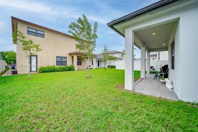 an aerial view of a house with a garden