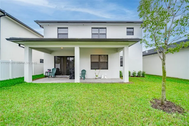 a garden view with a glass door