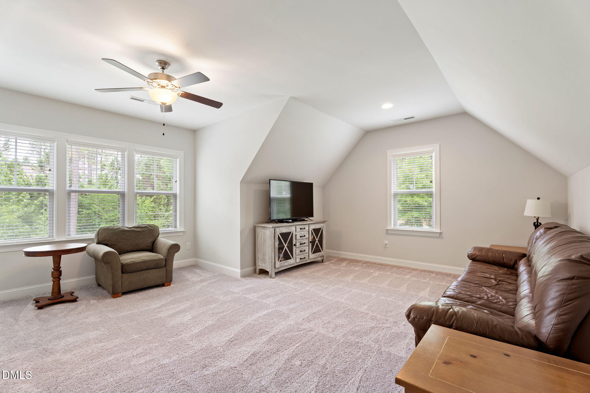 223 Colonial Ridge Drive Pittsboro, NC 27312 - Photo 31 of 47 a living room with furniture and a flat screen tv