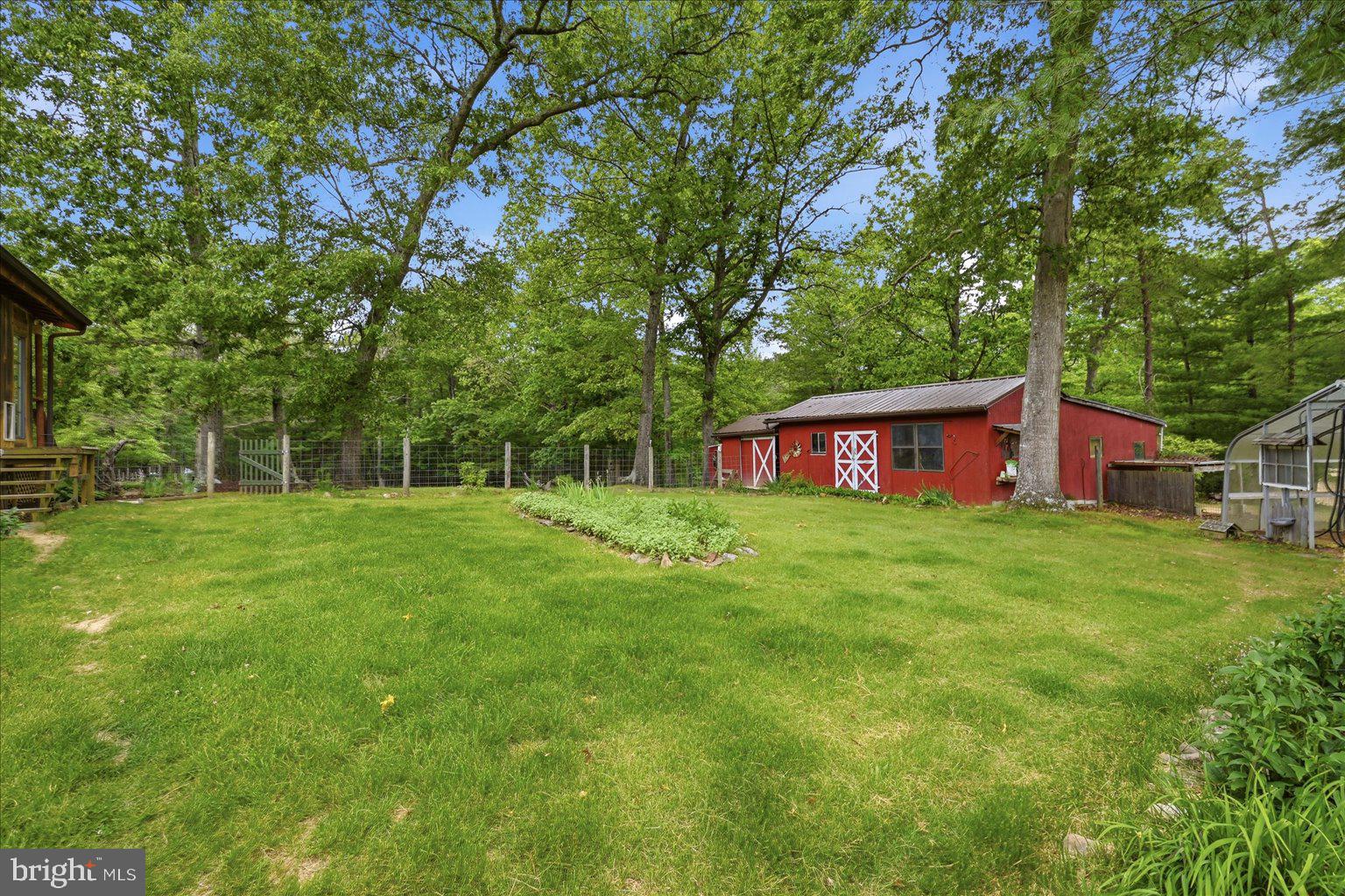 14636 Turner Road Fulks Run, VA 22830 - Photo 58 of 87 Charming red barn in lush greenery.