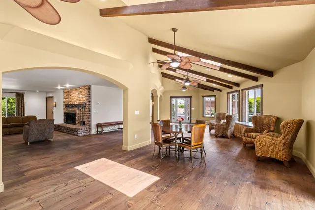a bathroom with a granite countertop double vanity sink and a mirror