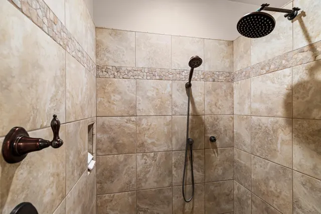 a white refrigerator freezer and a wooden floor in a room